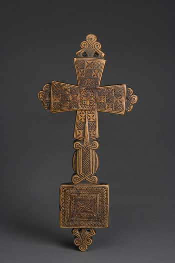 This 15th century cross has lobes filled with crosses
 surrounding a central Maltese cross. When in use in religious 
processions, colorful banners would be draped through the loops on the 
bottom. Photo by Thomas R. DuBrock